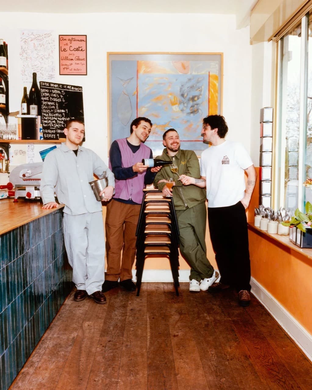 The team laughing together over a glass at the end of service.